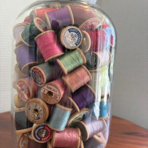 Vintage Spools of Thread in Gallon Jug