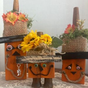 pumpkin-family-made-out-of-wood-shims-with-fancy-hats-and-cat-charms-11-8-5